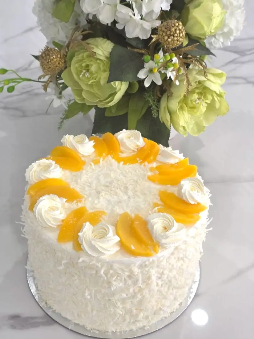 Coconut and peach tiered cake