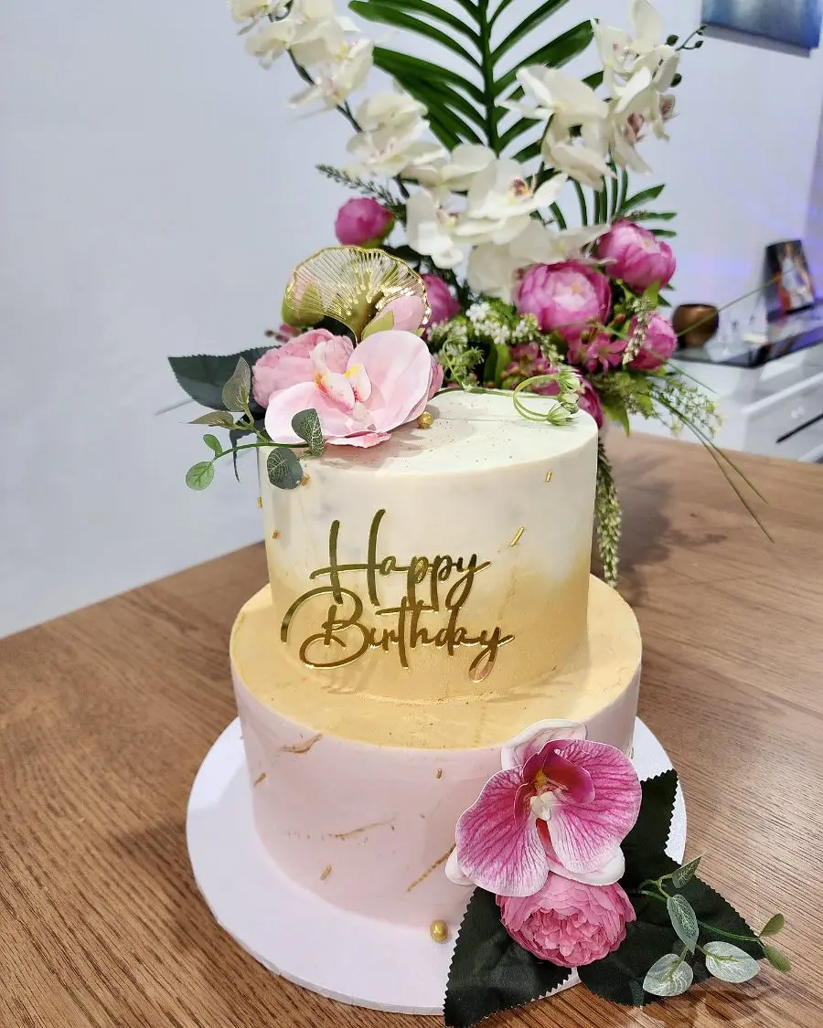 Pink and gold tiered birthday cake