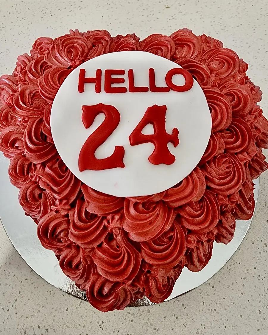 Red rosette heart cake