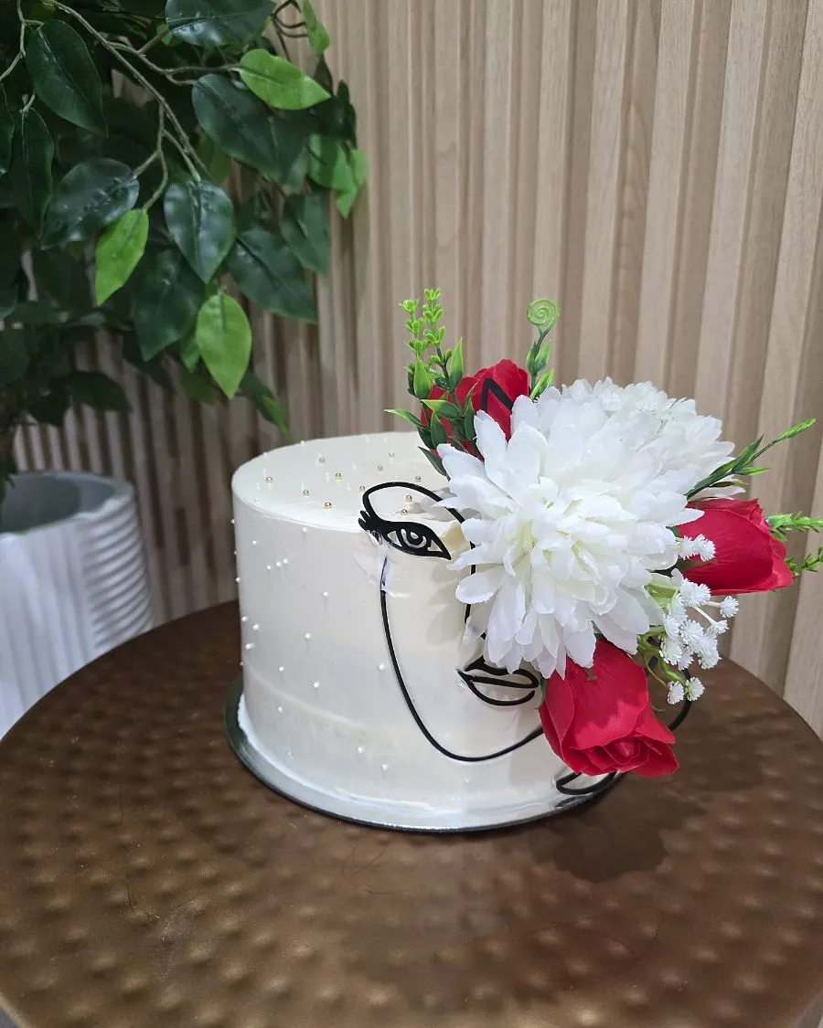 White line-art portrait cake